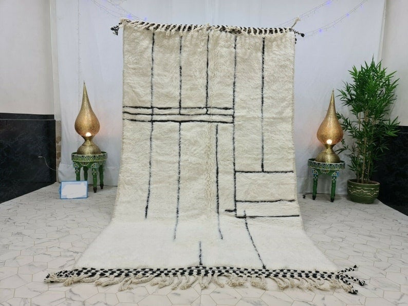 Authentic Moroccan Berber Handmade White Rug 8 x 5 Feet: Authentic Moroccan Berber Handmade White Rug 8 x 5 Feet Enhance your living space with this Authentic White Engraved Rug, a stunning piece handwoven by local Berber women in the Middle Atlas Mountains