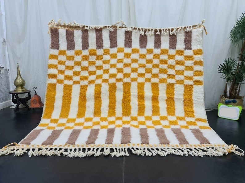 Handwoven Moroccan Berber Wool Rug 9.84 x 6.56 feet: Handwoven Moroccan Berber Wool Rug 9.84 x 6.56 feet Discover the beauty of this authentic handwoven Moroccan Berber wool rug, featuring a stunning design of assorted geometric shapes in white, yellow,