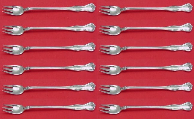 Tiffany & Co Provence Sterling Silver Fork Set 12 Pieces: Tiffany & Co Provence Sterling Silver Fork Set 12 Pieces Elevate your dining experience with this exquisite 12-piece cocktail fork set from Tiffany & Co., featuring the elegant Provence pattern. Craft