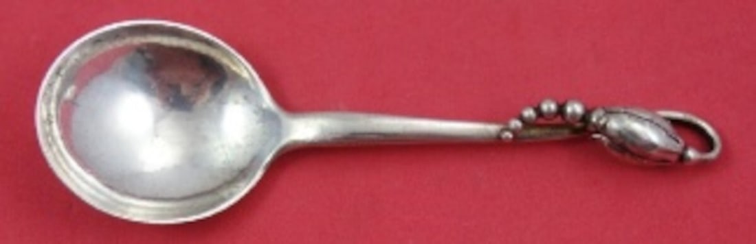 Georg Jensen Blossom Sterling Silver Bouillon Soup Spoon 5 1/8" GI Mark: Georg Jensen Blossom Sterling Silver Bouillon Soup Spoon 5 1/8" GI Mark Experience the elegance of the Blossom pattern by Georg Jensen with this exquisite Sterling Silver Bouillon Soup Spoon. Crafted