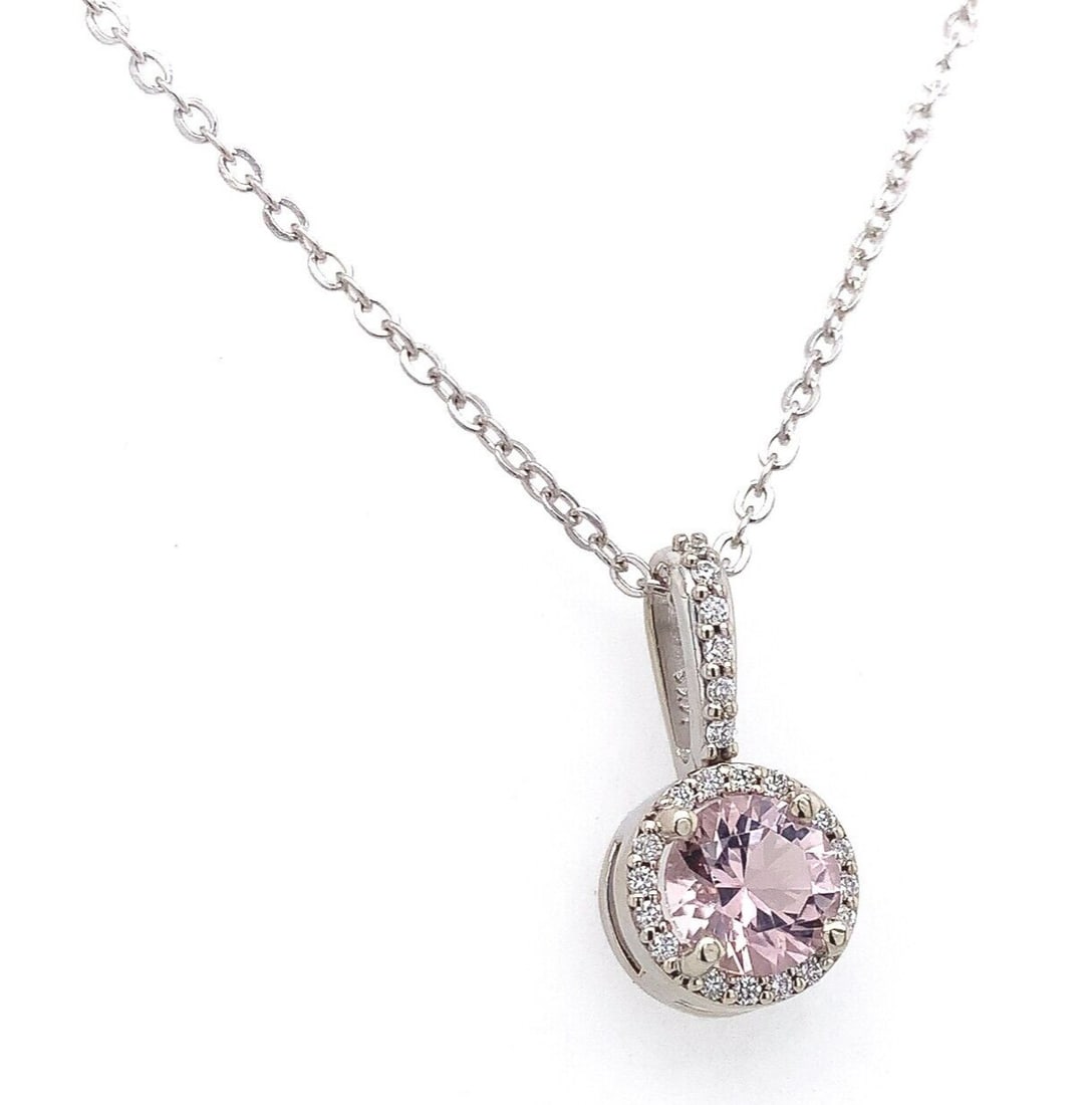 14k White Gold 0.58ct Pink Morganite Pendant Necklace with Diamond Halo: 14k White Gold 0.58ct Pink Morganite Pendant Necklace with Diamond Halo This stunning pendant features a 0.58ct genuine natural pink morganite, beautifully complemented by a diamond halo. Crafted in 1