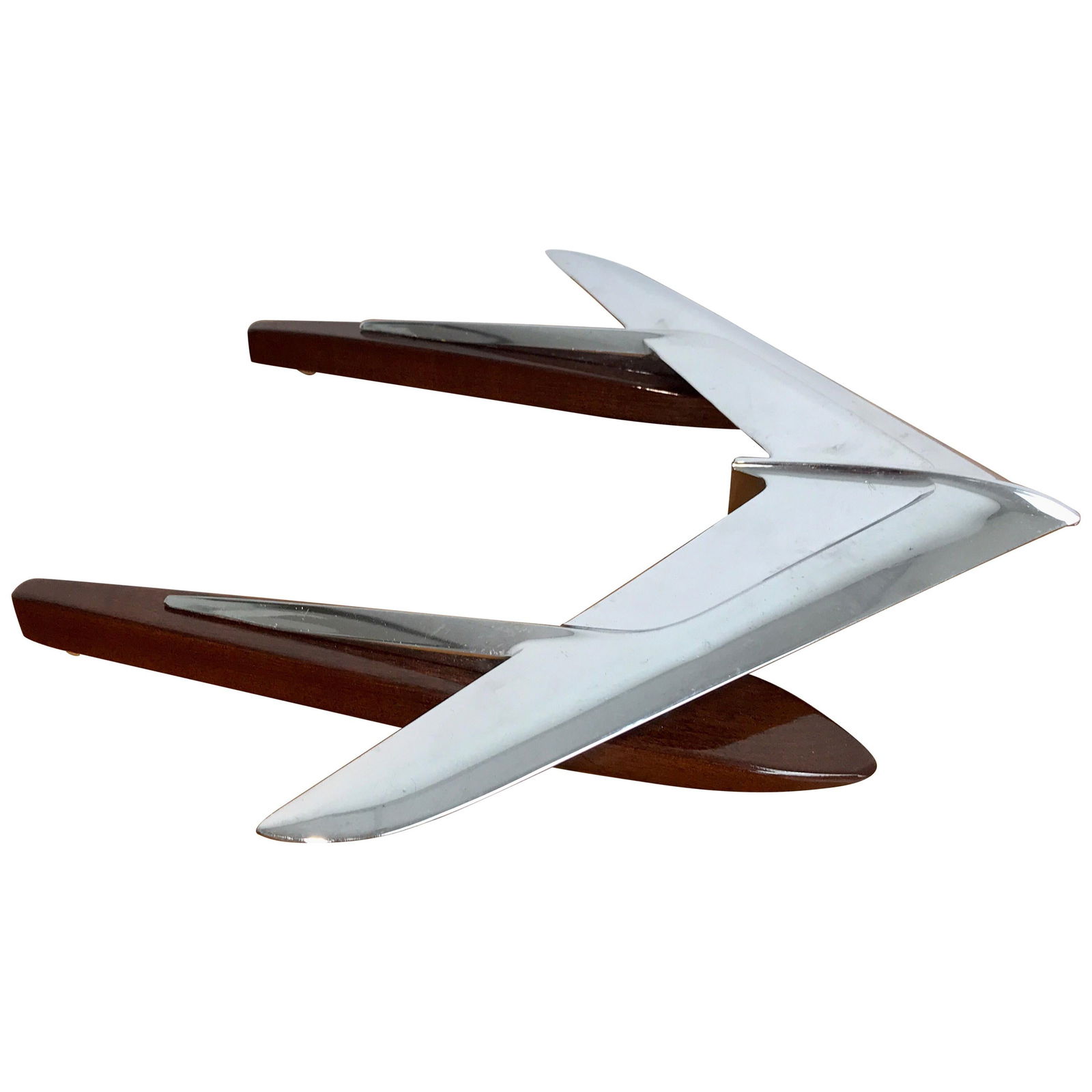 1950s Art Moderne Airplane Sculpture in Chrome and Hardwood: 1950s Art Moderne Airplane Sculpture in Chrome and Hardwood This stunning Art Moderne airplane sculpture from the 1950s showcases a perfect blend of modern design and craftsmanship. Elevated on a beau