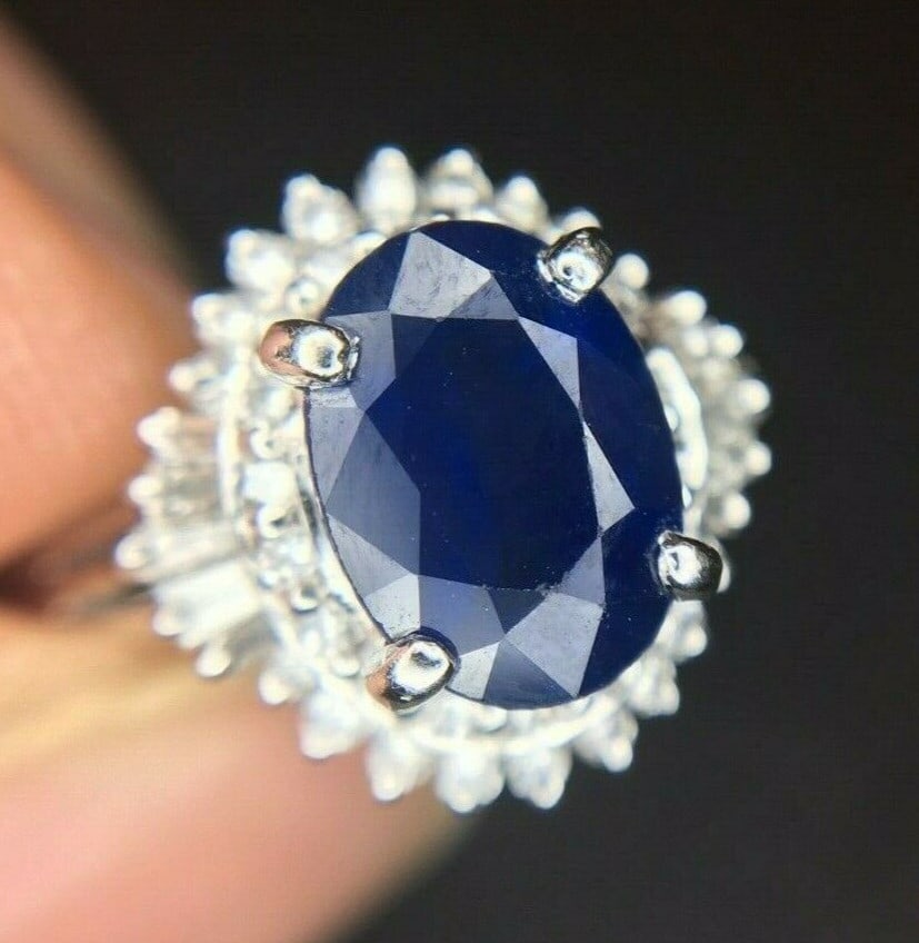 Platinum 1.42ct Blue Sapphire Diamond Ring with JAGI Certification: Platinum 1.42ct Blue Sapphire Diamond Ring with JAGI Certification This stunning platinum ring showcases a large 1.42ct genuine natural blue sapphire, beautifully complemented by a total of 0.40cts of