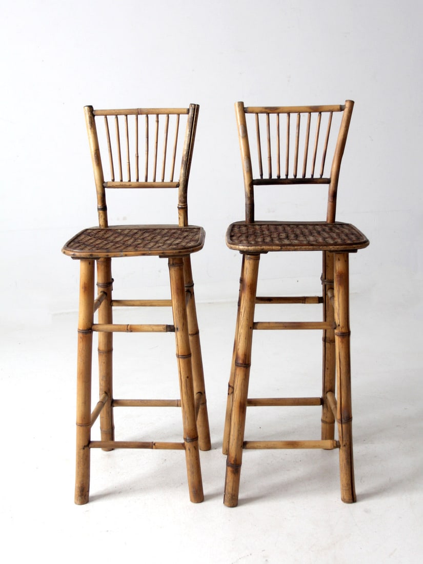 Vintage Mid-Century Bamboo Bar Stools Pair Tiki Style: Vintage Mid-Century Bamboo Bar Stools Pair Tiki Style This pair of mid-20th century bamboo bar stools embodies a classic mod tiki style, featuring sturdy bamboo frames and elegantly woven chevron cane
