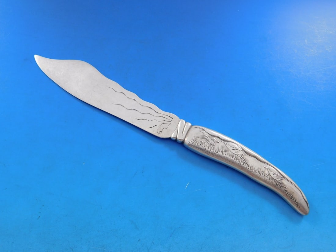 Tiffany Sterling Silver Fish Knife Lap Over Edge Acid Etched 7 7/8": Tiffany Sterling Silver Fish Knife Lap Over Edge Acid Etched 7 7/8" This exquisite fish knife from Tiffany & Co. features the elegant Lap Over Edge pattern, crafted from high-quality sterling silver.