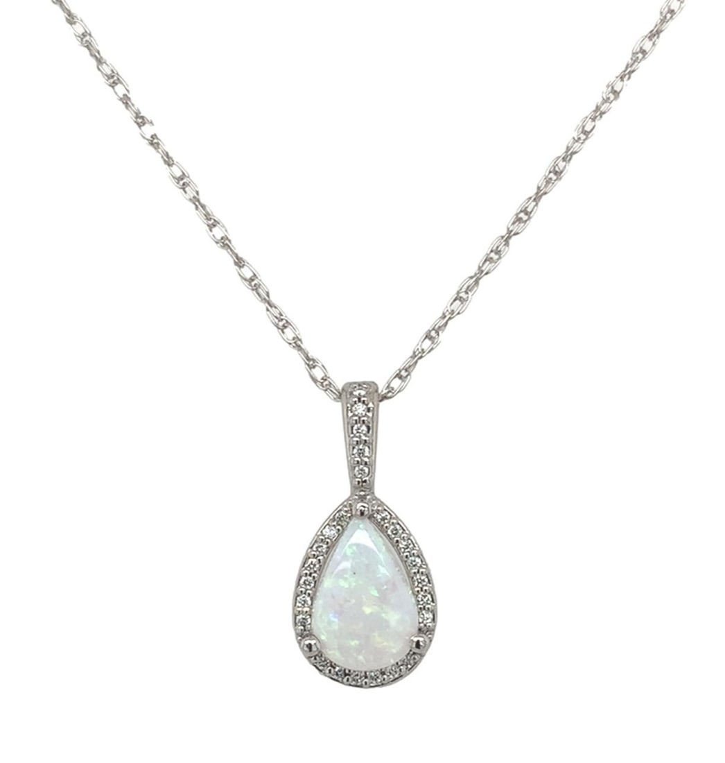 Platinum Halo Pendant with .54ct Australian Opal and 25 Diamonds: Platinum Halo Pendant with .54ct Australian Opal and 25 Diamonds This exquisite pendant features a stunning .54ct Australian genuine natural opal at its center, surrounded by a halo of 25 brilliant ro