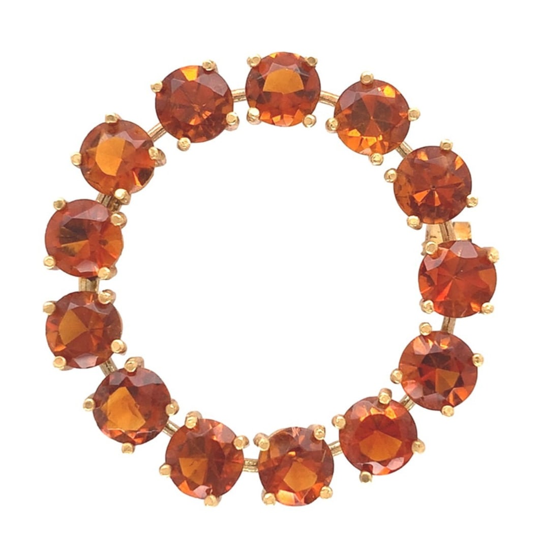 18k Yellow Gold Circle Pin Brooch with Vibrant Orange Citrine: 18k Yellow Gold Circle Pin Brooch with Vibrant Orange Citrine This exquisite 18k yellow gold circle pin brooch showcases a stunning arrangement of thirteen vibrant round citrines, each displaying a ca