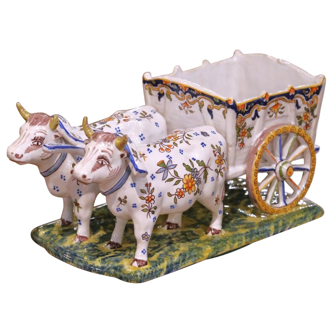 Quimper French Faience Oxen Cart Planter With Hand-Painted Folkloric Scene: Quimper French Faience Oxen Cart Planter With Hand-Painted Folkloric Scene This early 20th century French Quimper faience planter or vide poche is modeled as an ox-drawn farm cart and was crafted in Q