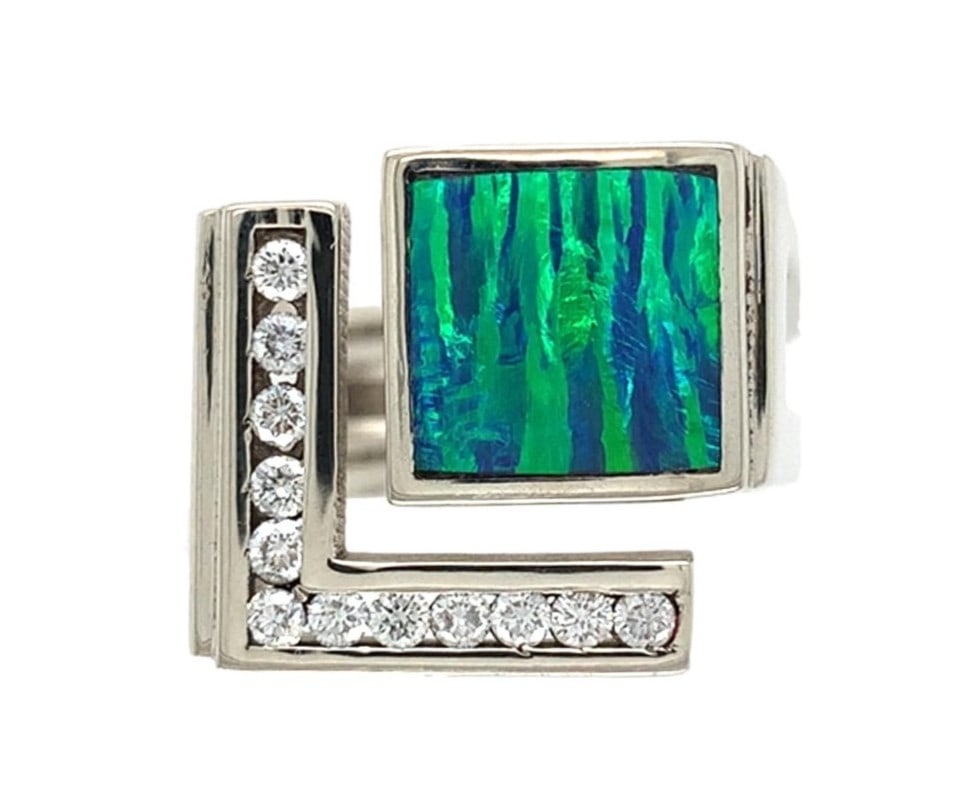 Harry Roa 14k White Gold Opal Diamond Ring Multicolor Design: Harry Roa 14k White Gold Opal Diamond Ring Multicolor Design This stunning 14k white gold ring features a custom design by Harry Roa, showcasing a genuine natural black opal at its center. The opal ex