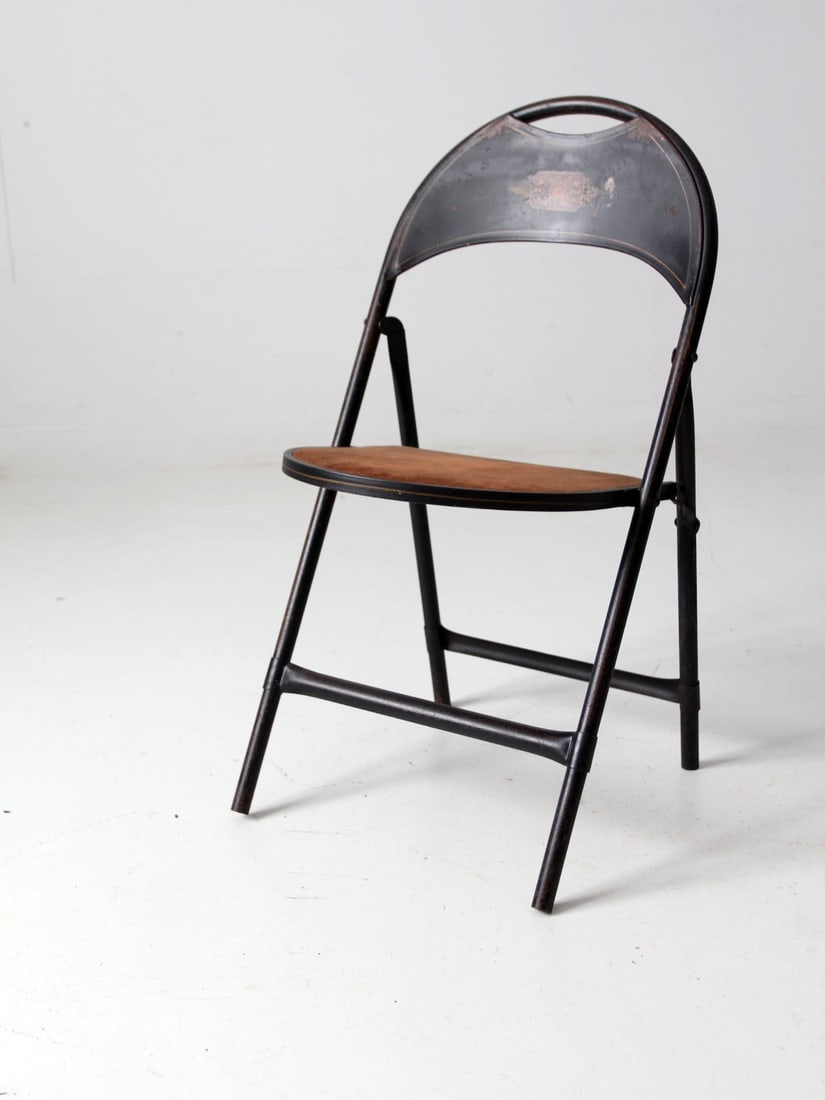 Vintage Folding Chair Black Metal Art Deco Velvet Seat: Vintage Folding Chair Black Metal Art Deco Velvet Seat This vintage metal folding chair from the early 20th century showcases a timeless design, featuring a sleek black metal frame complemented by a p