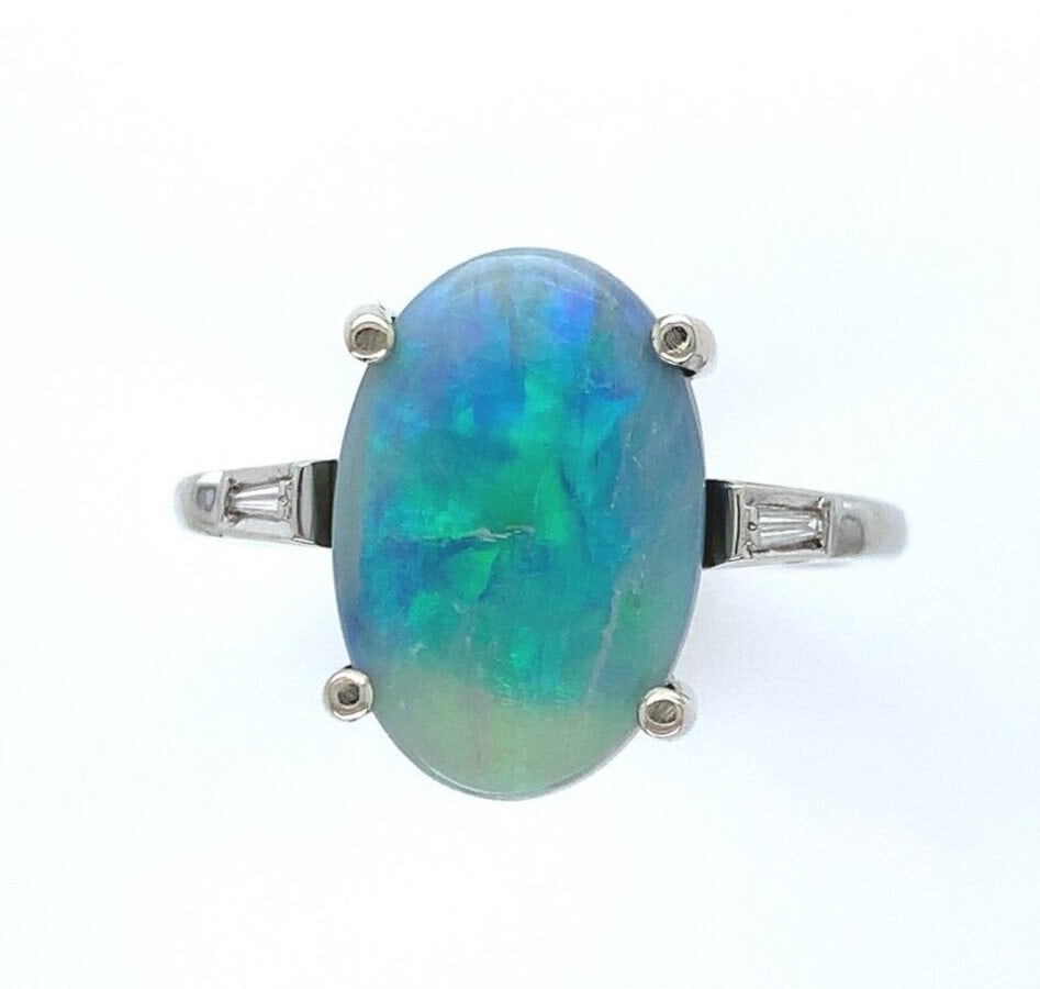 13k White Gold Vintage Opal Diamond Ring 3.04 Carats GIA Certified: 13k White Gold Vintage Opal Diamond Ring 3.04 Carats GIA Certified This exquisite ring features a stunning 3.04-carat genuine Australian opal, showcasing a light grey body color with dark grey accents