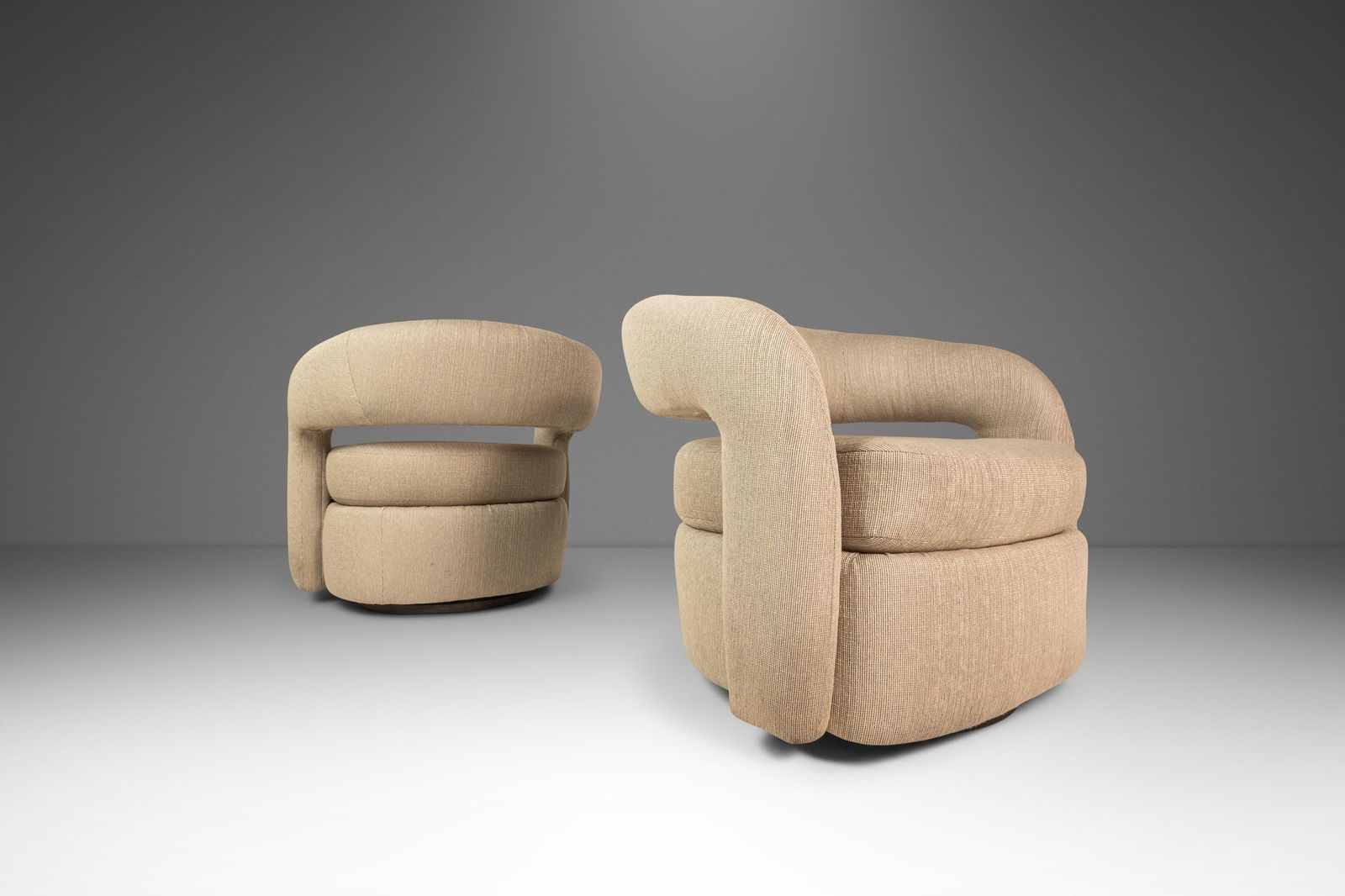 Pair of Mid-Century Modern Targa Swivel Chairs by Weiman for Interlude Home: Pair of Mid-Century Modern Targa Swivel Chairs by Weiman for Interlude Home This elegant set of two Mid-Century Modern "Targa" swivel chairs, designed by Weiman for Interlude Home and inspired by the