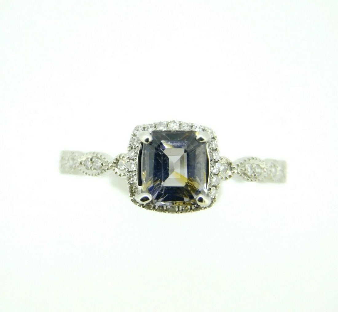 14k White Gold 1.23ct Grey Spinel Ring with Diamond Halo GIA Certified: 14k White Gold 1.23ct Grey Spinel Ring with Diamond Halo GIA Certified This stunning 14k white gold ring showcases a captivating 1.23ct grey genuine natural spinel, elegantly set in a halo of sparklin