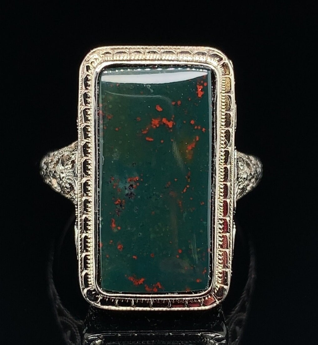 Art Deco 14k Gold Filigree Bloodstone Ring GIA Certified: Art Deco 14k Gold Filigree Bloodstone Ring GIA Certified This exquisite Art Deco ring showcases a genuine natural bloodstone set in a stunning 14k white gold filigree design. The rectangular bloodston