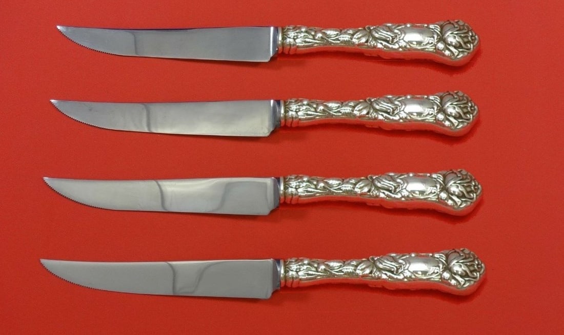 Alvin Bridal Rose Sterling Silver 4pc Steak Knife Set 8.5": Alvin Bridal Rose Sterling Silver 4pc Steak Knife Set 8.5" This exquisite 4-piece steak knife set showcases the elegant Bridal Rose pattern by Alvin. Crafted from sterling silver with hollow handles,
