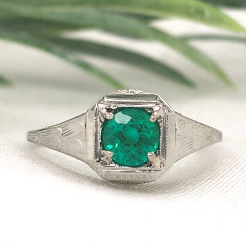 Art Deco 18k White Gold Filigree .39ct Emerald Ring GIA Certified: Art Deco 18k White Gold Filigree .39ct Emerald Ring GIA Certified This exquisite 18k white gold filigree ring showcases a genuine natural emerald, ideal for lovers of elegant vintage jewelry. The ring