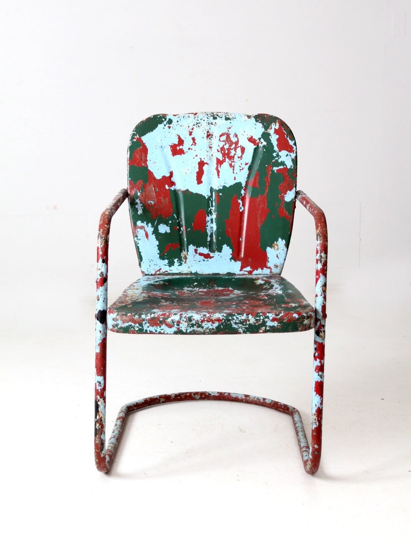 Vintage Mid Century Shott Style Patio Chair in Aged Blue: Vintage Mid Century Shott Style Patio Chair in Aged Blue Embrace the charm of mid-century design with this classic patio chair, inspired by the iconic Shott style. Featuring a bouncer frame and a beau