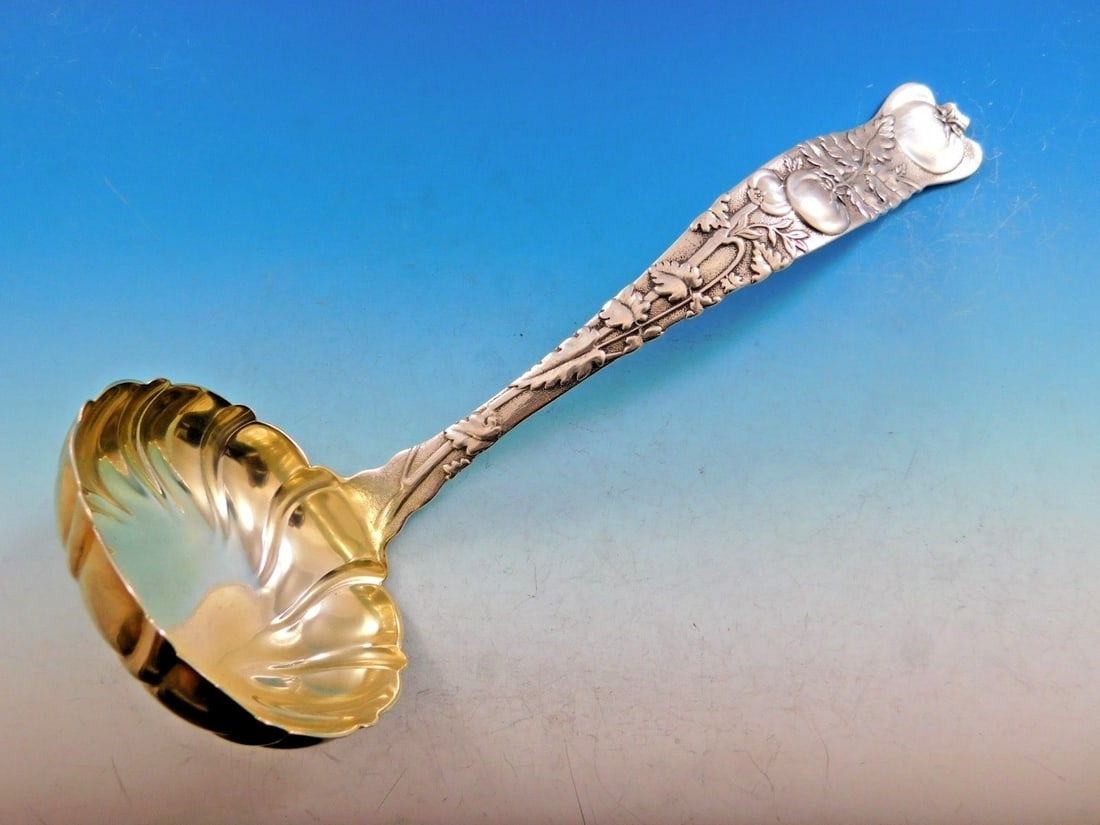 Tiffany & Co. Vine Sterling Silver Soup Ladle Gold-Washed 11 Inch Tomato Motif: Tiffany & Co. Vine Sterling Silver Soup Ladle Gold-Washed 11 Inch Tomato Motif This exquisite soup ladle from Tiffany & Co. is crafted in sterling silver and features the iconic Vine pattern, which da