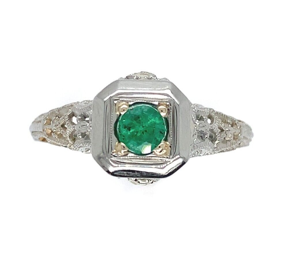 Art Deco 18k White Gold .21ct Emerald Ring Size 9.5: Art Deco 18k White Gold .21ct Emerald Ring Size 9.5 This exquisite Art Deco ring features a stunning 0.21ct genuine natural emerald set in intricately designed 18k white gold filigree. The emerald dis