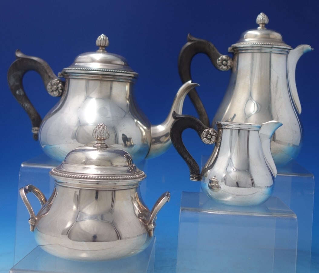 Christofle Sterling Silver 4-Piece Tea Set Vintage Beaded Design: Christofle Sterling Silver 4-Piece Tea Set Vintage Beaded Design This exquisite vintage 4-piece tea set by Christofle, crafted in sterling silver circa 1940s, showcases a stunning rosette design compl