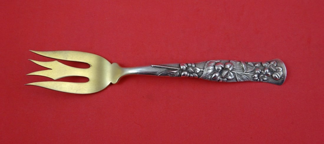 Sterling Silver 3-Tine Fish Fork Flora Pattern by Shiebler Gold Washed 7 Inch: Sterling Silver 3-Tine Fish Fork Flora Pattern by Shiebler Gold Washed 7 Inch This is a Shiebler Flora pattern fish fork crafted from sterling silver. It features three tines and a gold washed finish,