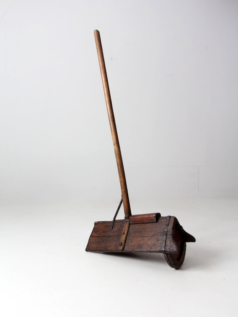 Antique Wooden Grain Tool 56.5in Long Handle Shovel: Antique Wooden Grain Tool 56.5in Long Handle Shovel Discover this antique primitive farm tool, a unique piece that reflects the craftsmanship of the past. This wooden grain tool features a long pole h
