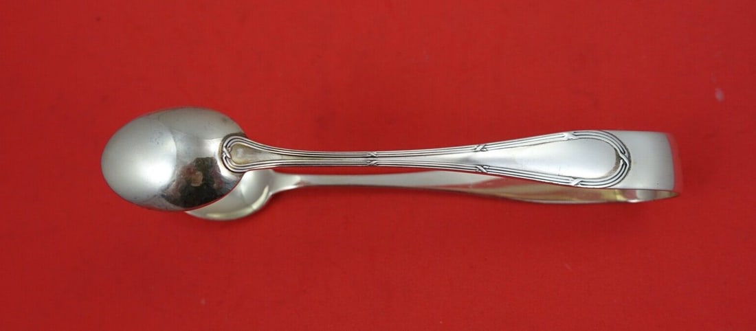 Buccellati Parma Sterling Silver Ice Tong Double Spoon 5 1/4": Buccellati Parma Sterling Silver Ice Tong Double Spoon 5 1/4" Elevate your serving experience with the Parma by Buccellati Sterling Silver Ice Tong Double Spoon, measuring 5 1/4 inches. This exquisite