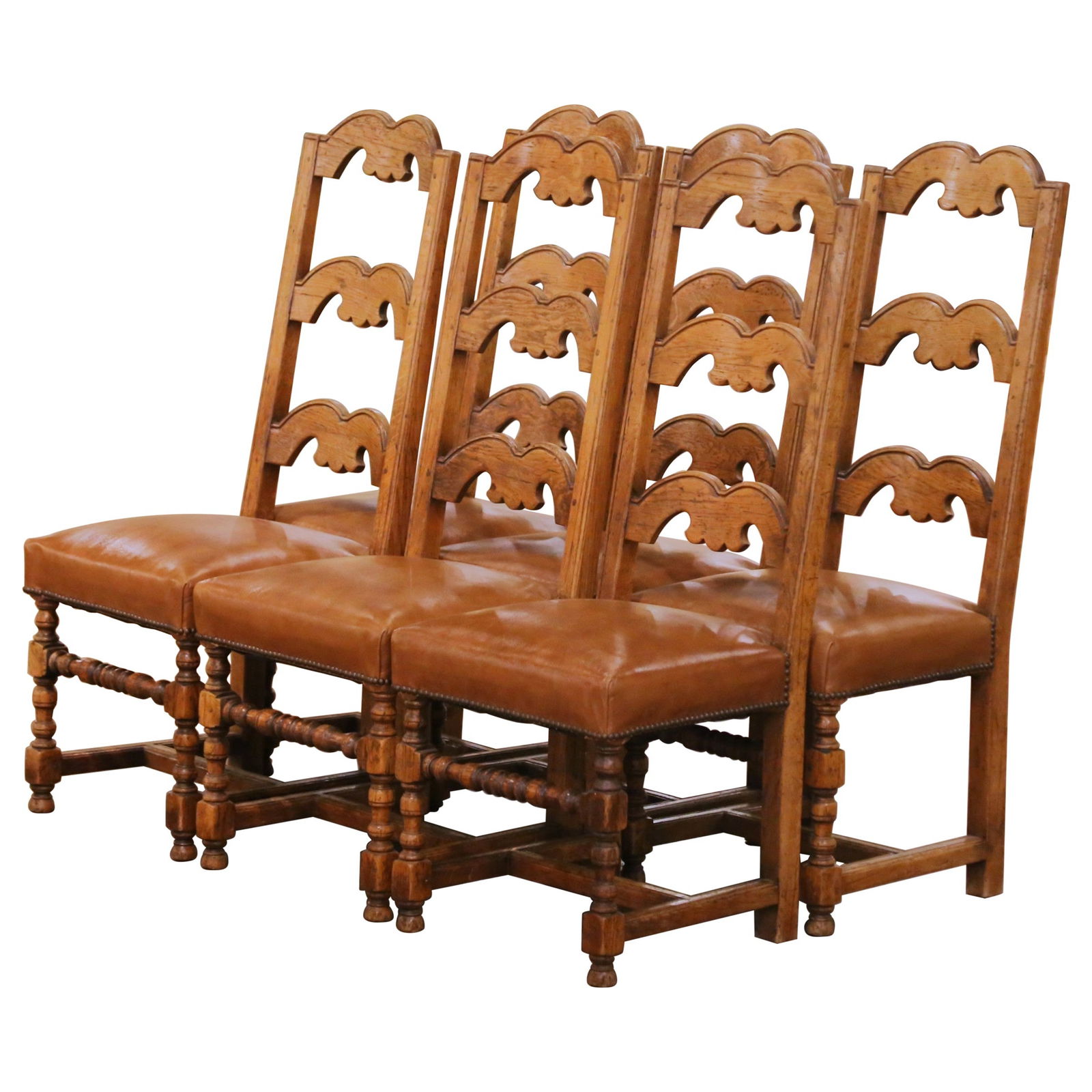 Set of 6 Louis XIII Style Oak Ladder Back Chairs With Leather Upholstered Seats: Set of 6 Louis XIII Style Oak Ladder Back Chairs With Leather Upholstered Seats This set includes six French Louis XIII style dining chairs, crafted in southern France around 1970. Each chair is const