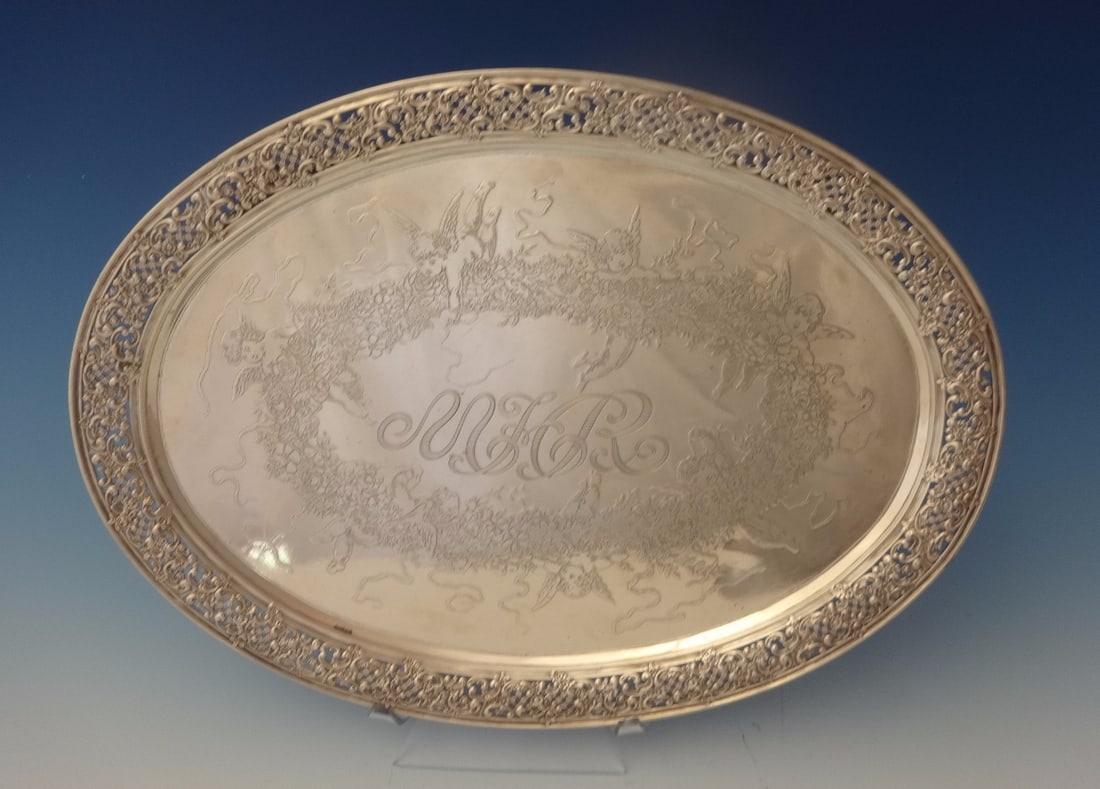 Sterling Silver Cherub Etched Footed Serving Tray with Lattice Rim: Sterling Silver Cherub Etched Footed Serving Tray with Lattice Rim This Tiffany & Co. sterling silver footed tray dates from 1873-1891 and showcases intricate acid-etched detailing of a wreath encircl