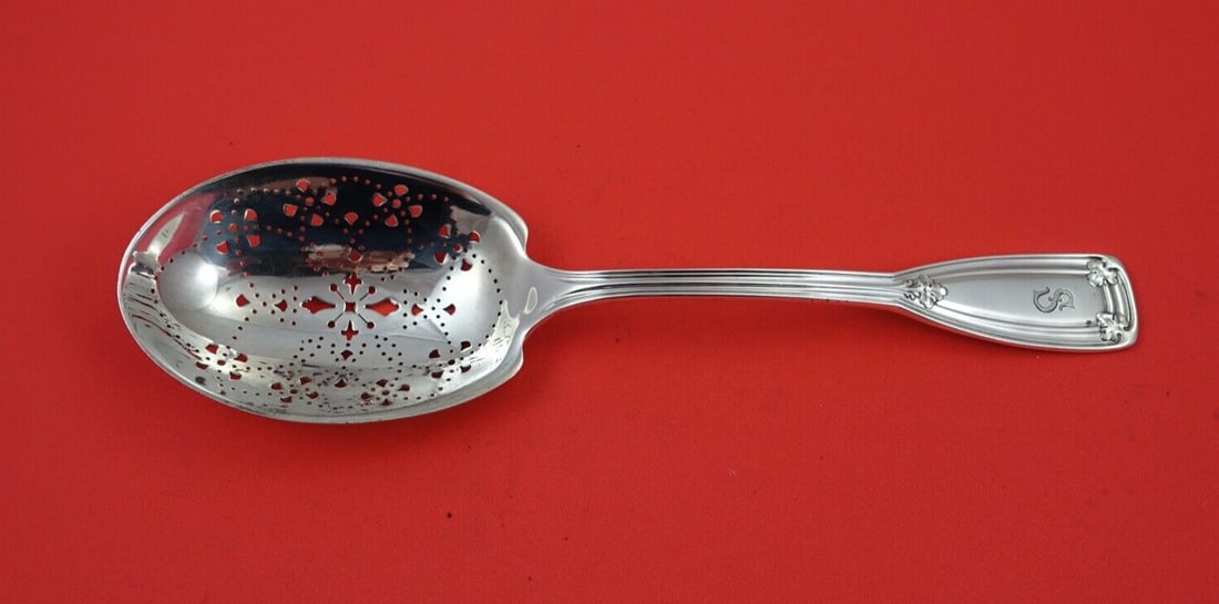 Tiffany & Co. Saint Dunstan Sterling Silver Ice Spoon 9 1/8": Tiffany & Co. Saint Dunstan Sterling Silver Ice Spoon 9 1/8" This exquisite ice spoon from the renowned Saint Dunstan pattern by Tiffany & Co. is a stunning example of fine craftsmanship. Made of ster