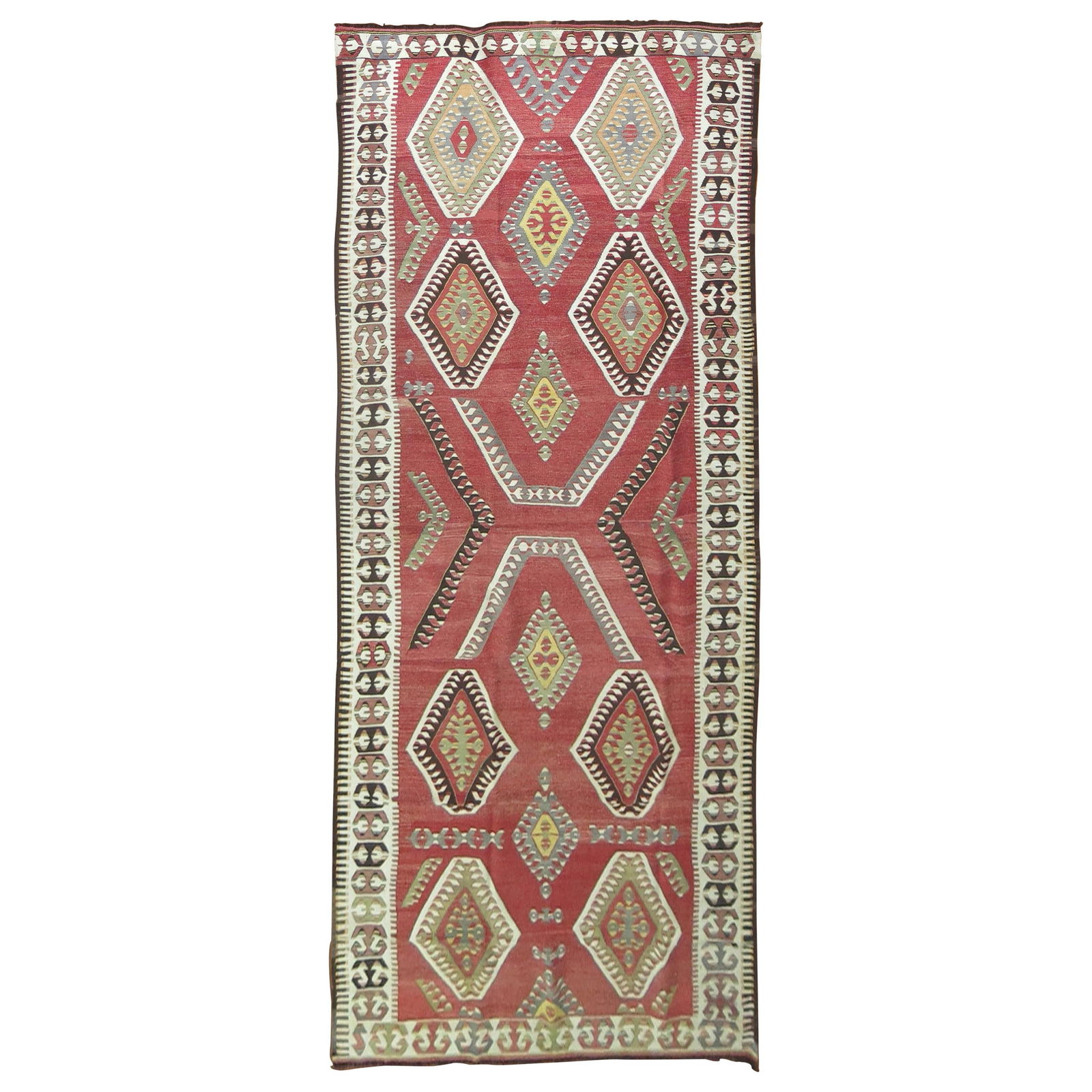 Vibrant Tribal Red Wool Turkish Kilim Runner 58 x 147 in: Vibrant Tribal Red Wool Turkish Kilim Runner 58 x 147 in Add a touch of ethnic charm to your space with this stunning Tribal Red Turkish Gallery Kilim Runner. This early 20th-century piece showcases a