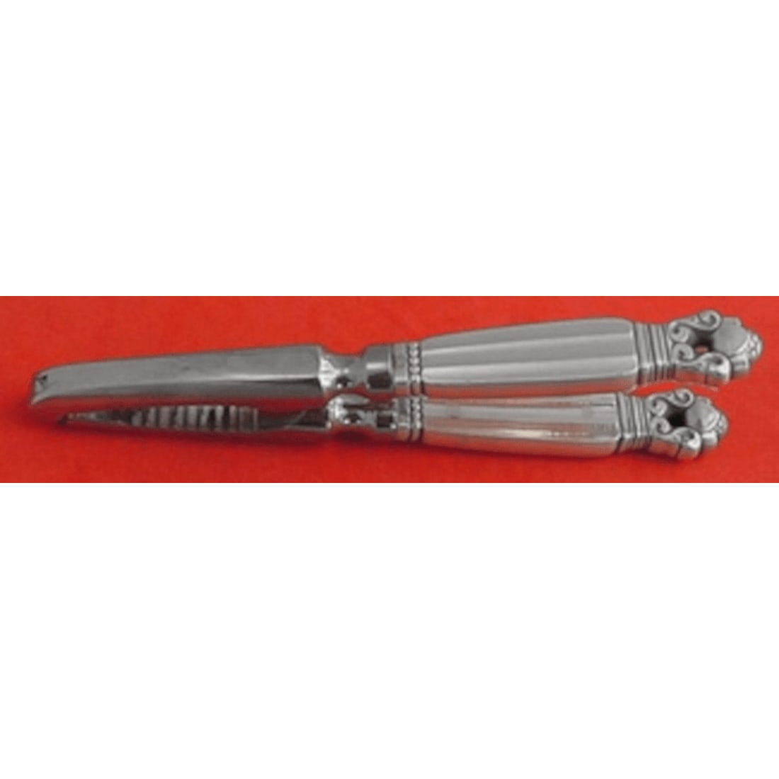 Georg Jensen Acorn Sterling Silver Nut Cracker 6 Inch: Georg Jensen Acorn Sterling Silver Nut Cracker 6 Inch Enhance your dining experience with the Acorn Nut Cracker by Georg Jensen, a stunning piece crafted in sterling silver. This elegant nut cracker f