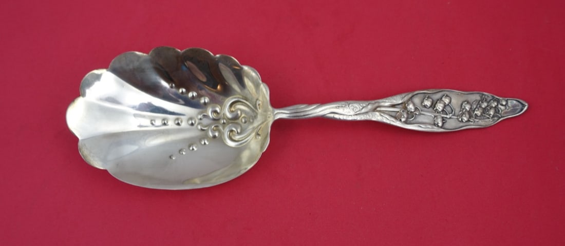 Whiting Lily of the Valley Sterling Silver Pudding Spoon 9 5/8": Whiting Lily of the Valley Sterling Silver Pudding Spoon 9 5/8" This exquisite serving spoon, part of the 'Lily of the Valley' pattern by Whiting, showcases the elegance of 19th-century craftsmanship.