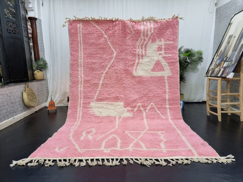 Handmade Soft Pink Moroccan Berber Wool Area Rug 9.84 x 6.56 feet: Handmade Soft Pink Moroccan Berber Wool Area Rug 9.84 x 6.56 feet Discover the beauty of this stunning Soft Pink Handmade Moroccan Berber Wool Area Rug. Expertly handwoven in the Atlas Mountains by sk