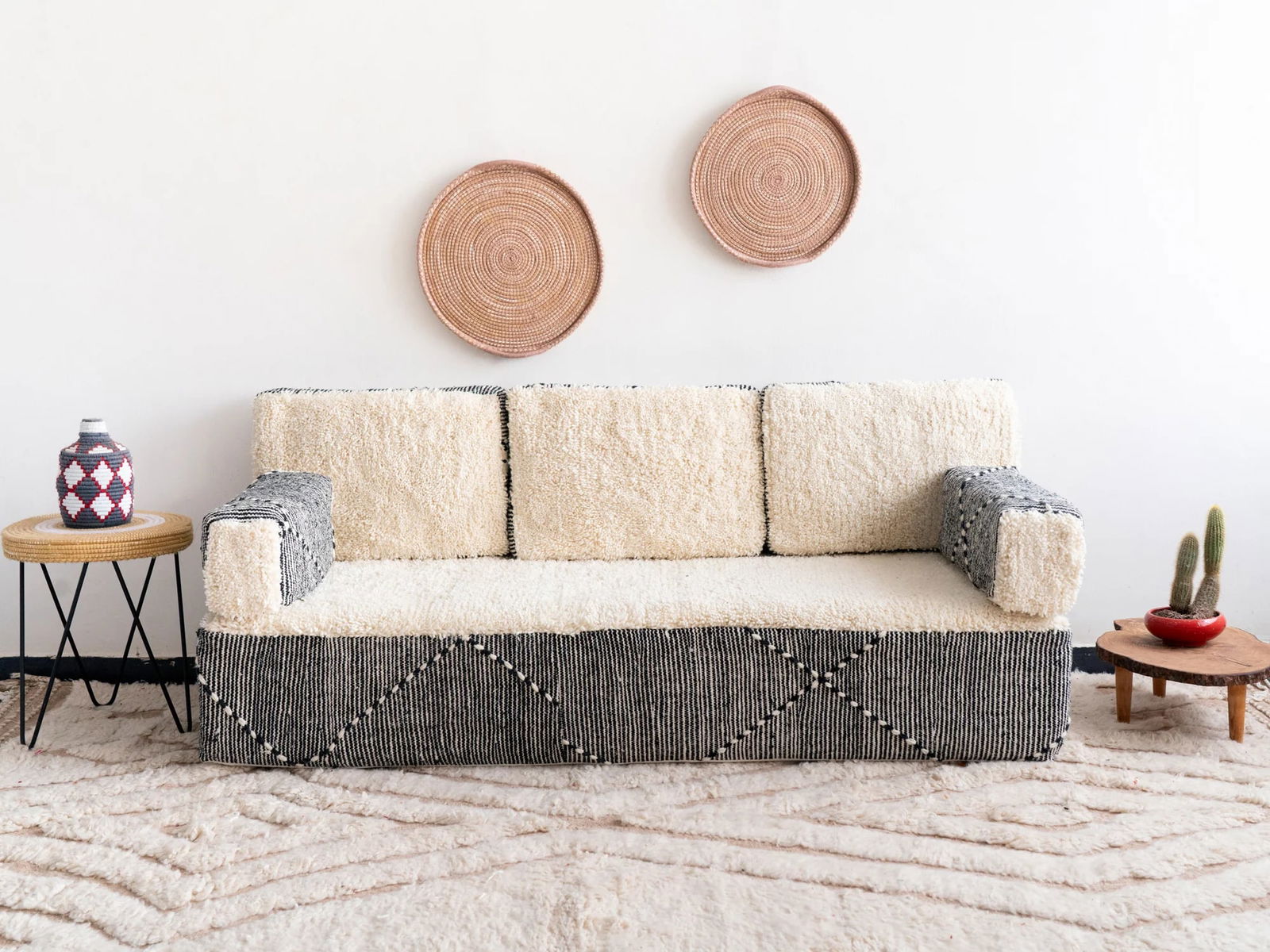 Handmade Moroccan Berber Sofa Two-Tone Cream and Black Artisan Craftsmanship: Handmade Moroccan Berber Sofa Two-Tone Cream and Black Artisan Craftsmanship Transform your living space with the Handmade Moroccan Berber Sofa in a stunning Two-Tone Cream & Black Edition. This exqui
