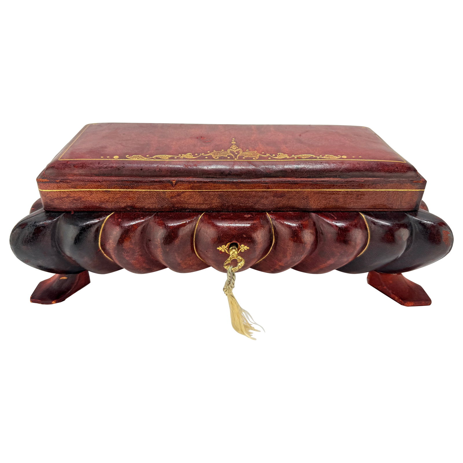 Mid-Century Italian Leather Jewelry Box with Gilt Tooling and Musical Feature: Mid-Century Italian Leather Jewelry Box with Gilt Tooling and Musical Feature This Italian leather-clad tabletop jewelry or trinket box from the mid-20th century showcases exceptional craftsmanship an