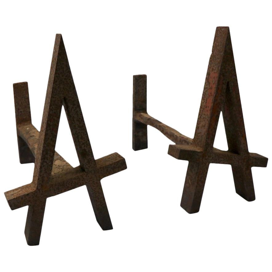 Unique Capital A Wrought Iron Andirons with Aged Rust Patina: Unique Capital A Wrought Iron Andirons with Aged Rust Patina This substantial pair of architectural andirons features a unique capital A form, crafted from solid stock wrought iron with an aged rust p