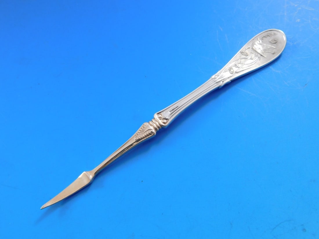 Tiffany & Co Japanese Sterling Silver Nut Pick with Rose Gold 4 7/8": Tiffany & Co Japanese Sterling Silver Nut Pick with Rose Gold 4 7/8" This exquisite nut pick is crafted from sterling silver by Tiffany & Co., featuring a stunning rose gold pick. Designed in the eleg