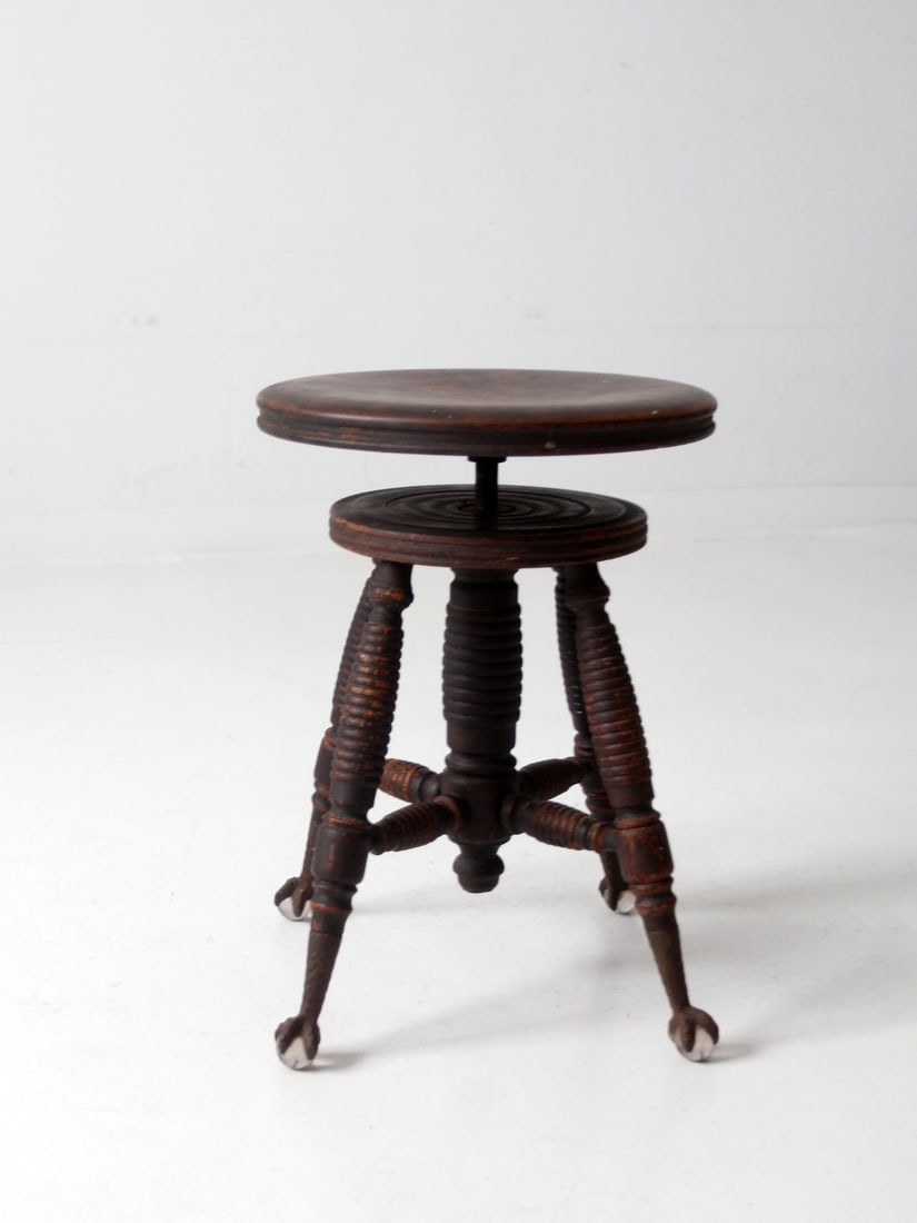 Vintage Adjustable Claw and Ball Foot Piano Stool 1880s: Vintage Adjustable Claw and Ball Foot Piano Stool 1880s This exquisite antique claw and ball foot piano stool showcases a stylish design from the 1880s. It features a cast iron turning mechanism, allo