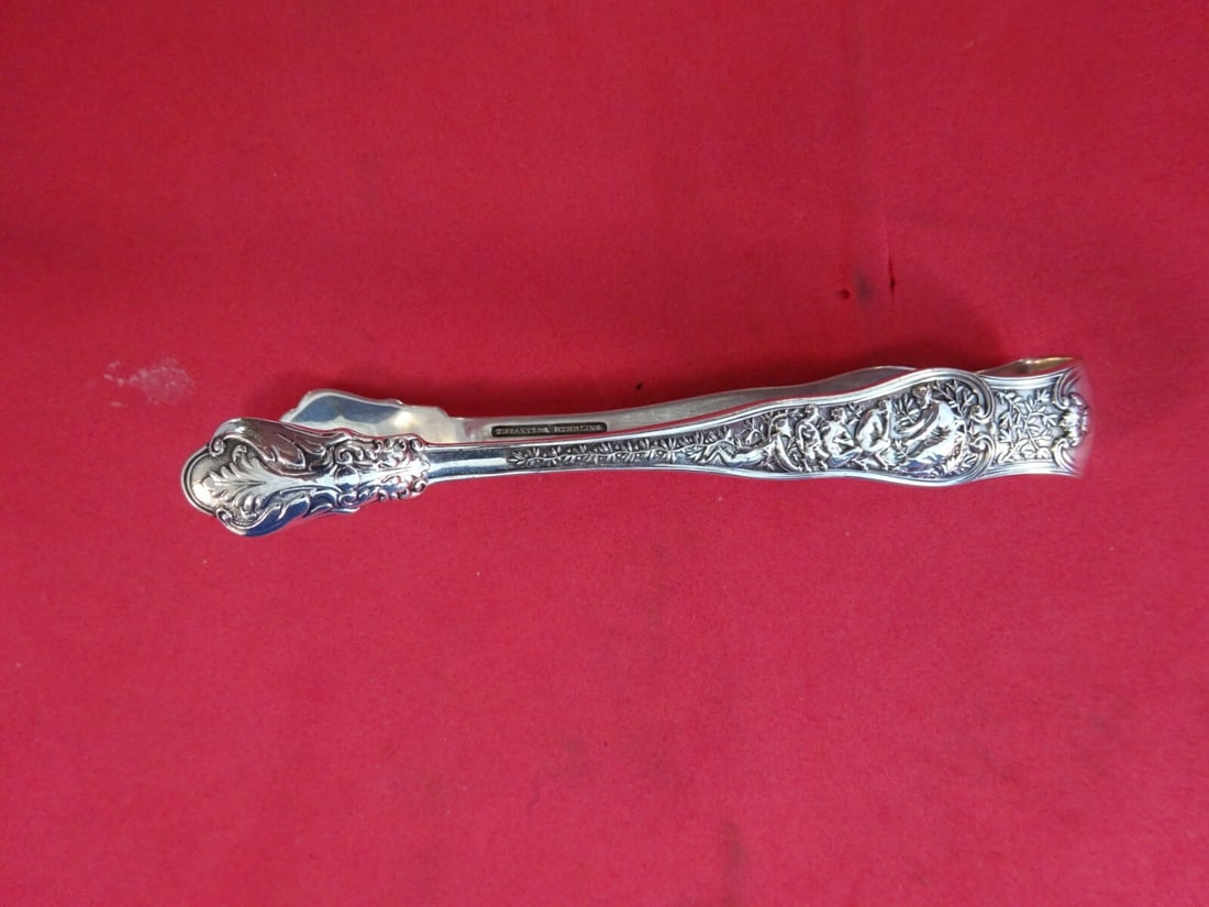 Tiffany & Co Olympian Sterling Silver Sugar Tongs Antique 4" Serving Pieces: Tiffany & Co Olympian Sterling Silver Sugar Tongs Antique 4" Serving Pieces This exquisite set of Sterling Silver Sugar Tongs features the renowned Olympian pattern by Tiffany & Co., dating back to th