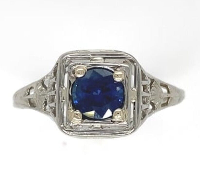 Art Deco 18k Gold Filigree Ring .57ct Blue Sapphire: Art Deco 18k Gold Filigree Ring .57ct Blue Sapphire This stunning 18k Gold Filigree Ring showcases a captivating .57ct genuine natural blue sapphire, beautifully set in an intricate Art Deco design. T