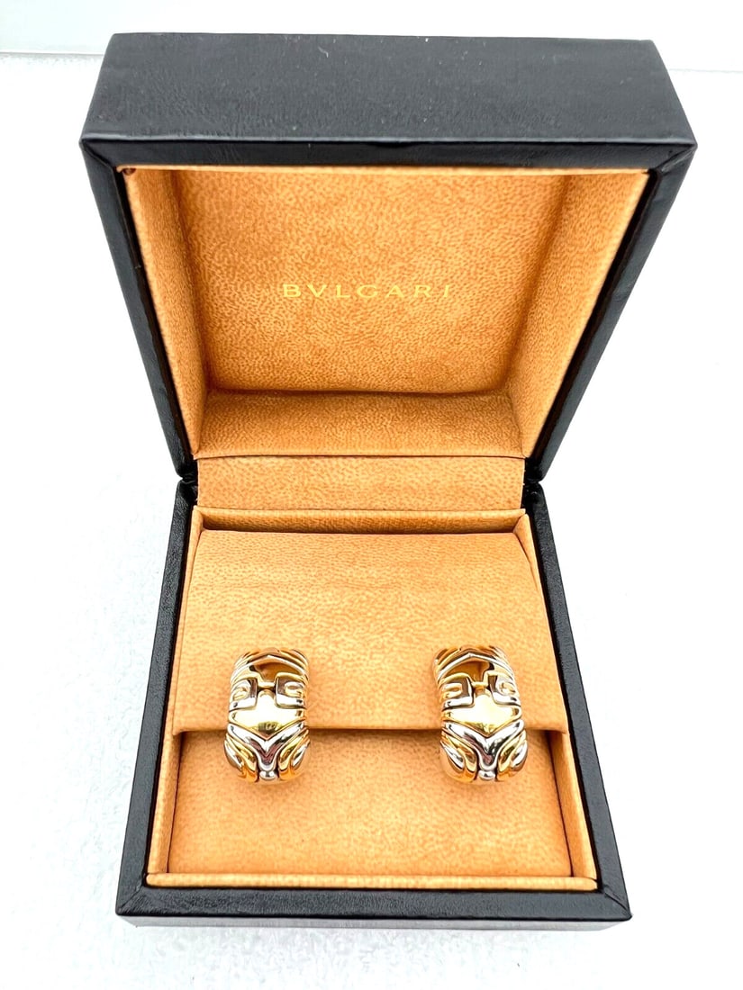 Bvlgari 18K Yellow White Gold Cuff Earrings with Box 30.70g: Bvlgari 18K Yellow White Gold Cuff Earrings with Box 30.70g This exquisite pair of Bvlgari earrings features a stunning combination of 18K yellow and white gold, showcasing exceptional craftsmanship a
