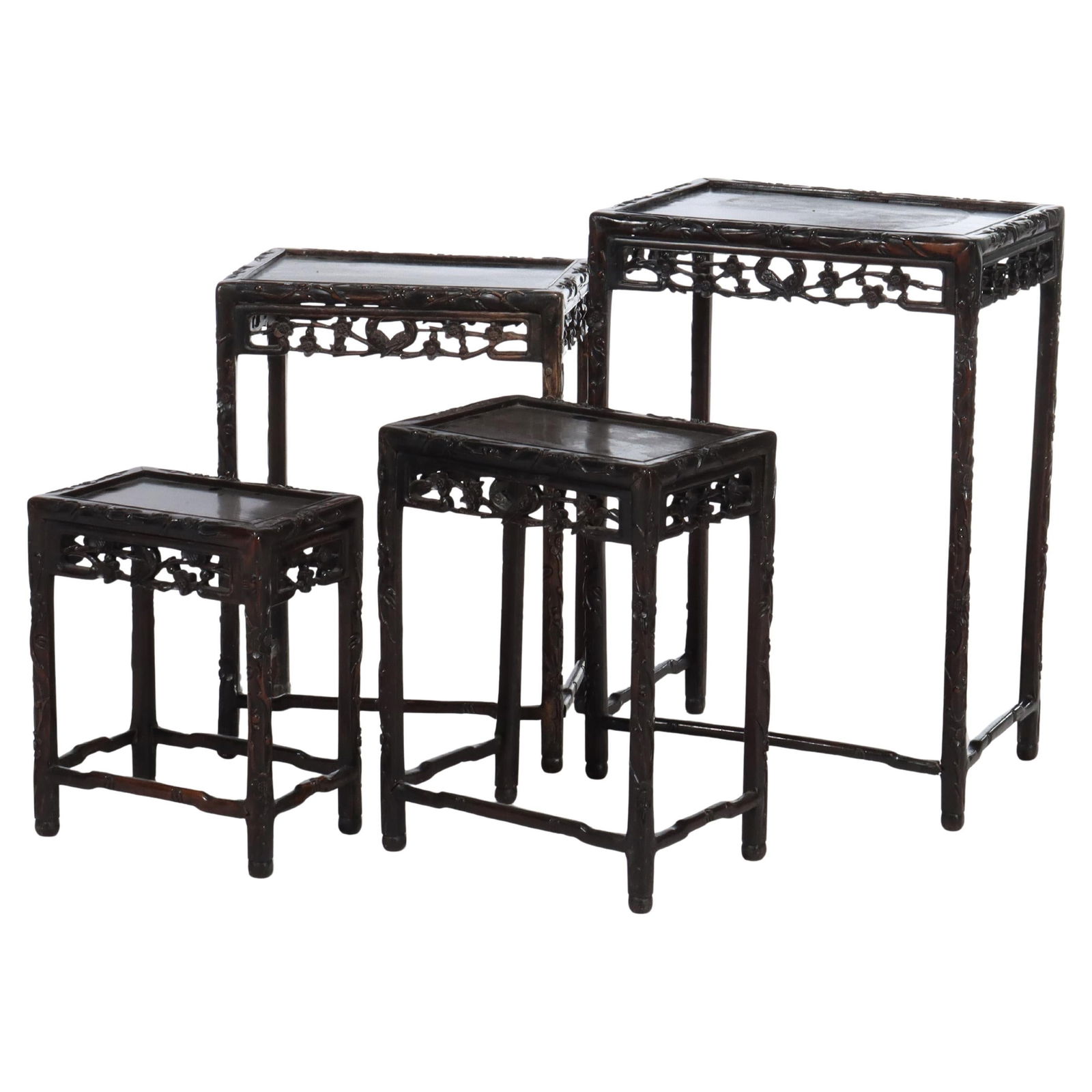 Set of 4 Antique Chinese Hardwood Nesting Tables with Floral Carvings C1900: Set of 4 Antique Chinese Hardwood Nesting Tables with Floral Carvings C1900 This exquisite set of four antique Chinese nesting tables showcases intricate floral and figural carvings, highlighting the