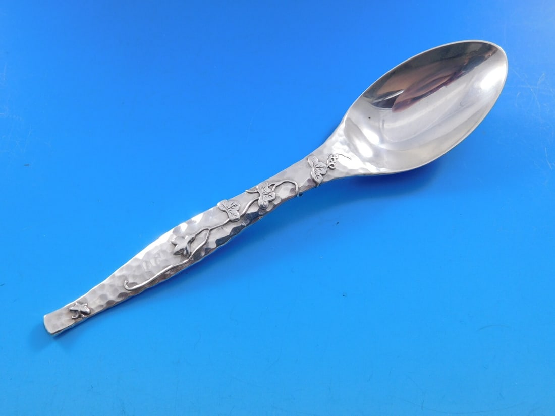 Tiffany & Co Sterling Silver Teaspoon Lap Over Edge Grapes Leaves 6 1/4in: Tiffany & Co Sterling Silver Teaspoon Lap Over Edge Grapes Leaves 6 1/4in This exquisite sterling silver teaspoon from Tiffany & Co. features the elegant Lap Over Edge pattern, showcasing beautifully