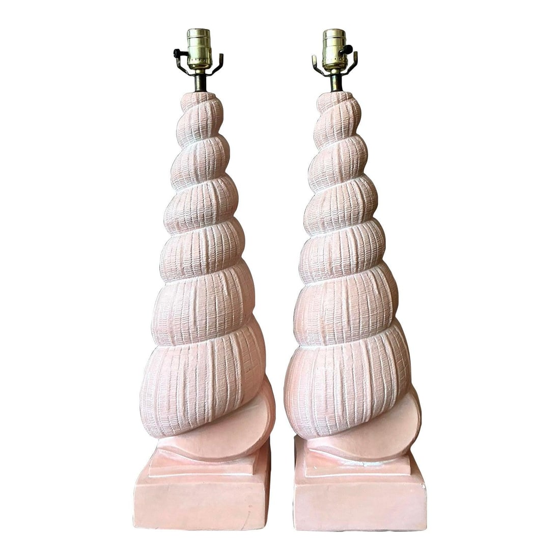 Pair of Plaster Table Lamps with Shell Motif and Matte Peach Finish: Pair of Plaster Table Lamps with Shell Motif and Matte Peach Finish This pair of vintage plaster shell lamps embodies the sculptural elegance of 1980s postmodern design. Inspired by spiraling auger sh