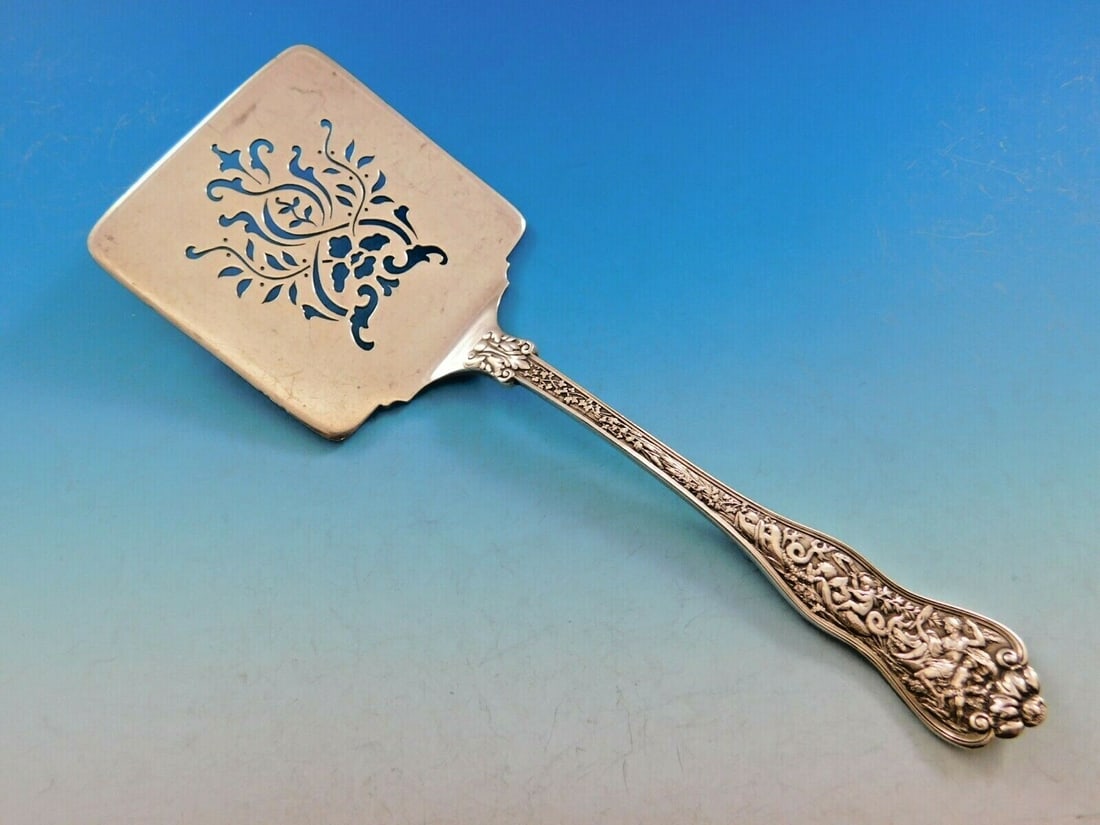 Tiffany & Co Olympian Sterling Silver Waffle Server 9 Inches: Tiffany & Co Olympian Sterling Silver Waffle Server 9 Inches Discover the exquisite craftsmanship of the Olympian pattern by Tiffany & Co., a sterling silver waffle server. Measuring 9 inches, this vi