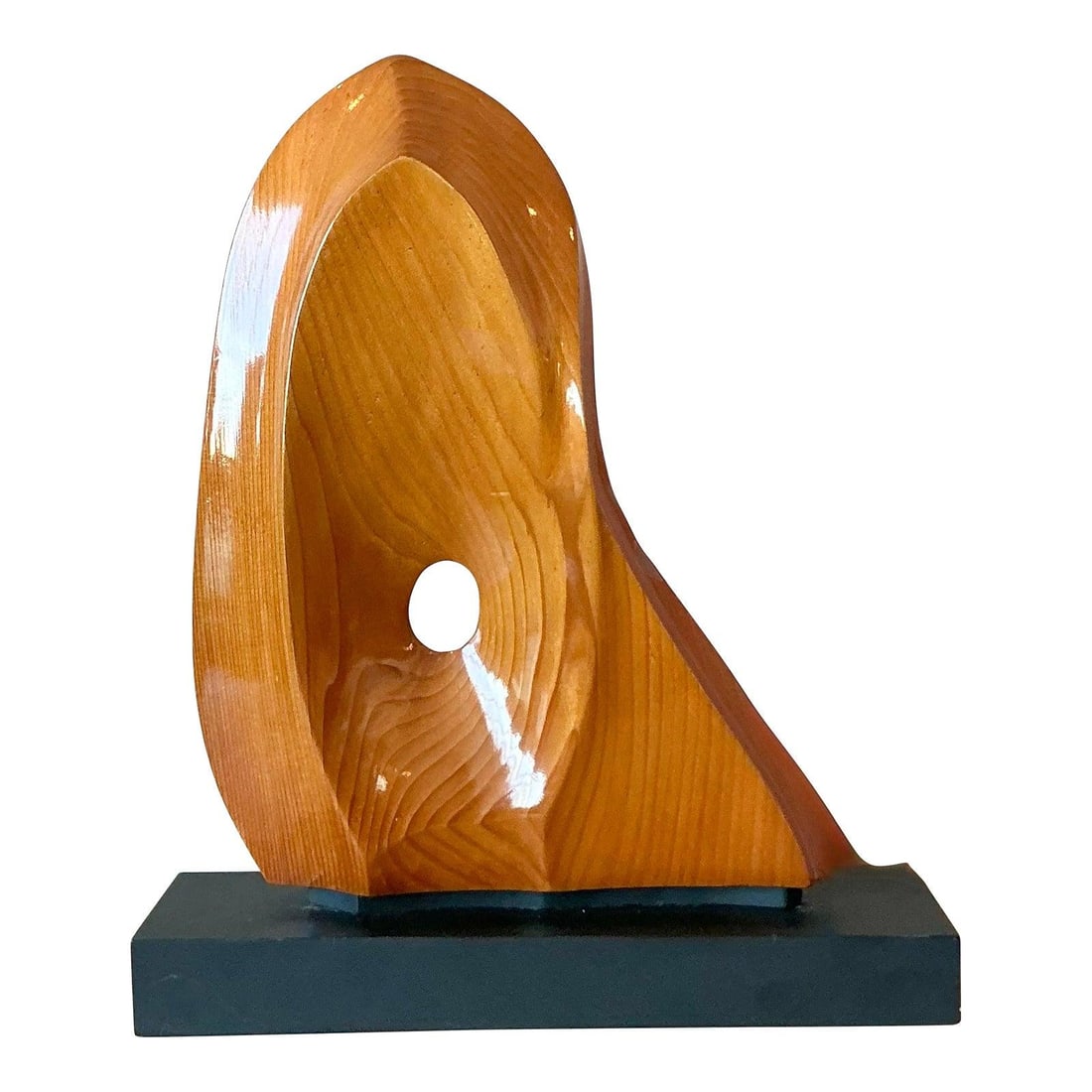 Polished Wood Organic Modern Abstract Sculpture on Minimalist Base: Polished Wood Organic Modern Abstract Sculpture on Minimalist Base This vintage abstract sculpture is crafted from polished wood, featuring sensuous curves and a striking natural grain. The piece is d