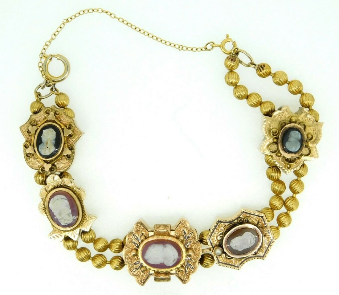 Victorian Slide Bracelet With Natural Stone Cameos And Gold Accents: Victorian Slide Bracelet With Natural Stone Cameos And Gold Accents This Victorian XL gold slide bracelet showcases genuine natural stone cameos in an exquisite antique design. The bracelet features t
