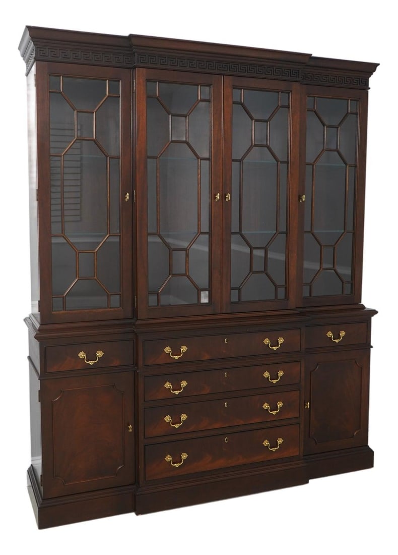 Mahogany Breakfront Bookcase with Glass Shelves and Brass Hardware Georgian Style: Mahogany Breakfront Bookcase with Glass Shelves and Brass Hardware Georgian Style This Stickley breakfront bookcase features a Georgian style design crafted from mahogany wood. The bookcase is compose