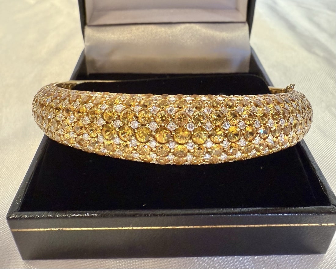 French 18K Yellow Gold Diamond Yellow Sapphire Cuff Bracelet: French 18K Yellow Gold Diamond Yellow Sapphire Cuff Bracelet This exquisite French cuff bracelet is crafted from 18K yellow gold and features a stunning combination of yellow sapphires and GSI diamond